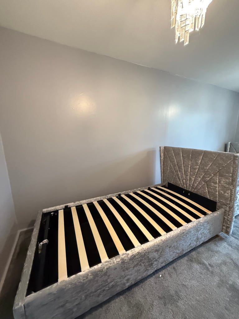 Beautifully assembled velvet bed frame in modern bedroom